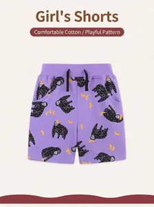 Detail of girls' purple cotton shorts showing elastic waist and cute monkey pattern