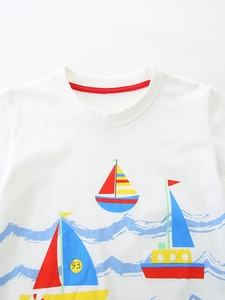 Boy's white cotton T-shirt featuring colorful cartoon sailboat print and round neck collar