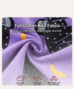 Close-up of soft purple cotton knit fabric with monkey and banana cartoon prints