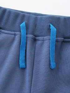 Navy blue boys' sports shorts with elastic ribbed waistband and light blue drawstrings