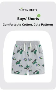 Close-up of boys' cotton shorts featuring elastic drawstring waist and truck print