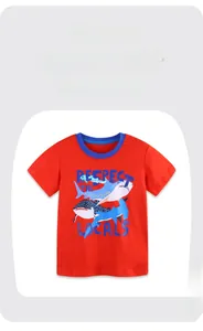 Close-up of red cotton boy's T-shirt with shark print and blue contrast neckline