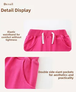 Detail of rose pink girls' shorts showing elastic ribbed waistband and white drawstring