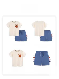 Detailed views of cotton kids summer set with dinosaur print and side fin shorts