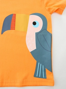 T-shirt enfant en coton orange vif avec un imprimé graphique de toucan coloré