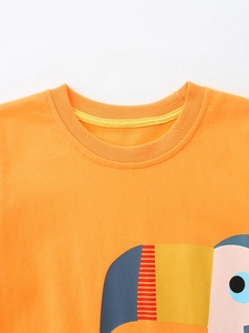 T-shirt enfant en coton orange avec imprimé toucan et col rond de style classique