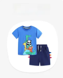 Detail of blue boys' summer outfit showing cartoon animal prints and drawstring shorts