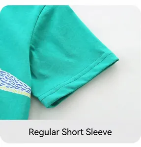 Detail of bright green cotton t-shirt sleeve with dinosaur print and durable stitching