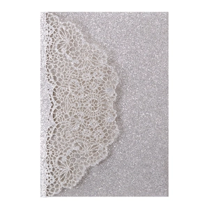 Detailed laser-cut silver glitter wedding invitation card with floral lace pattern