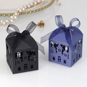 Detailed laser-cut hollow house gift boxes in black and navy blue with organza ribbons
