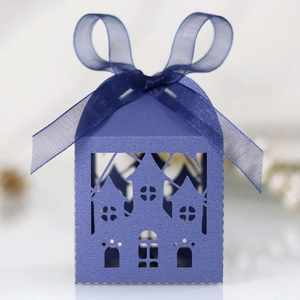 Detailed laser-cut dark blue Halloween favor box with castle cutout and organza ribbon bow