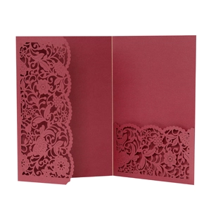 Laser cut wine red wedding invitation featuring intricate floral patterns and tri-fold design