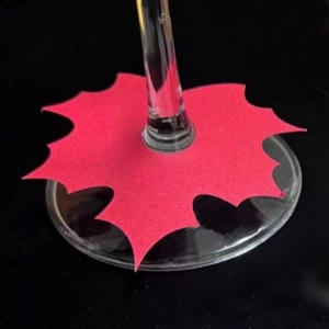Red holly leaf paper place cards for wine glass decoration in Christmas party events
