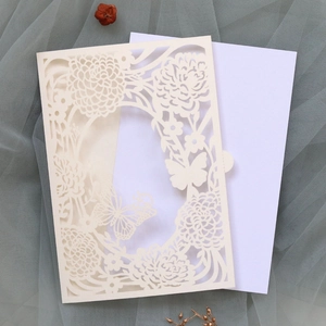 Detailed laser cut floral and butterfly wedding invitation with elegant hollow patterns