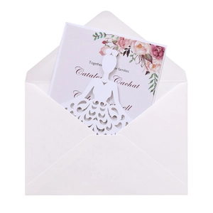 Detail of laser-cut floral wedding invitation with elegant watercolor flower design