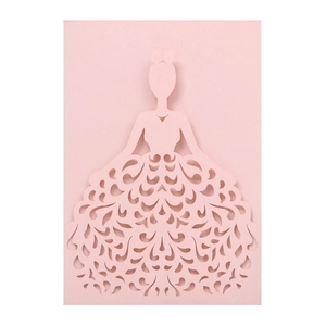 Detail showing laser-cut floral pattern on the pink dress-shaped wedding invitation