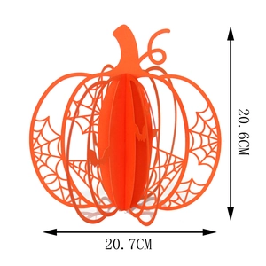 Detail view of a 3D orange hollow pumpkin paper lantern with spider web patterns