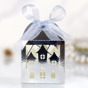 Detailed laser-cut silver castle gift box with a light blue satin ribbon bow