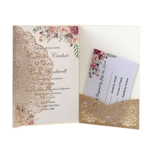 Detail of laser-cut glitter wedding invitation set with floral card and RSVP insert