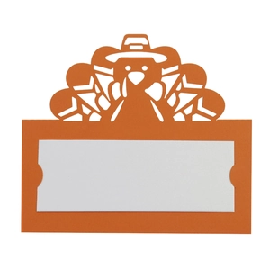 Detail of laser-cut turkey place card in orange for Thanksgiving table settings