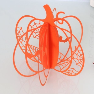 3D hollow carved orange pumpkin table decoration with spider web and bat cutout details