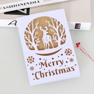 Detailed laser-cut Christmas card with reindeer motif and Merry Christmas lettering