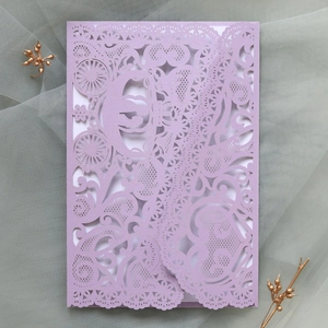 Detailed laser-cut lace wedding invitation with lilac hollow carriage design on pearl paper