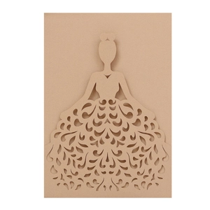 Macro shot of laser-cut wedding card featuring elegant lady silhouette on kraft paper