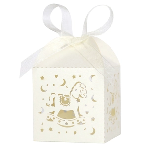 Detail of laser-cut rocking horse candy box with creamy white paper and organza ribbon bow
