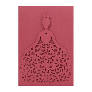 Macro detail of laser-cut burgundy invitation cover with elegant dress silhouette