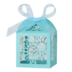 Detail of light blue hollow sun pattern candy box with a matching ribbon bow tie