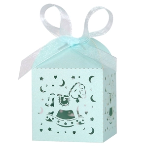 Detail of light blue hollow-out rocking horse gift box with a white ribbon bow