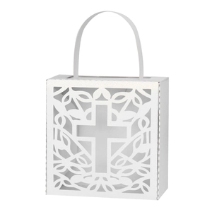 Detail of white laser-cut hollow cross candy box with elegant vine patterns and handles