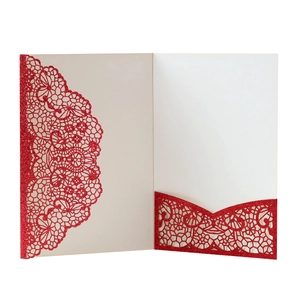 Detailed laser-cut lace texture on red glitter paper wedding invitation card