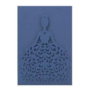 Macro shot of dark blue laser-cut wedding invitation featuring elegant feminine silhouette