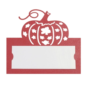 Detail of laser-cut orange pumpkin place card with white insert for Thanksgiving tables