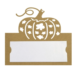 Detail of laser-cut pumpkin place card with kraft paper texture and insert for handwriting