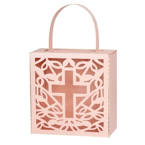 Pink laser-cut cross favor box with intricate vine patterns and elegant carry handles