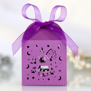 Detailed close-up of a purple laser-cut rocking horse candy box with a ribbon bow
