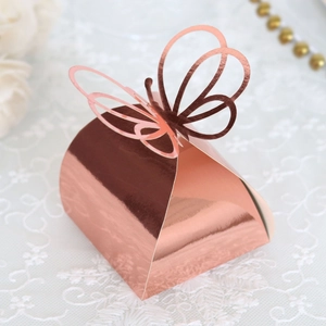 Detailed close-up of rose gold butterfly candy box with laser-cut hollow design