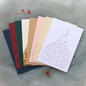 Detailed laser-cut wedding cards in various colors with elegant bridal dress patterns