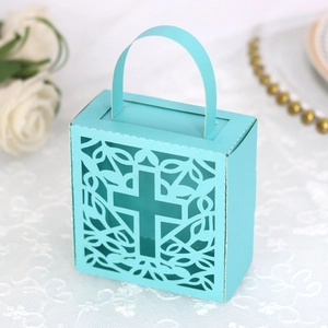 Detail of laser-cut cross pattern on blue pearlescent paper wedding favor gift box
