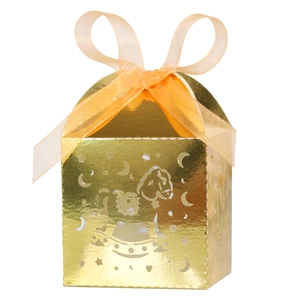 Detail of laser-cut hollow rocking horse candy box in gold with ribbon for baby parties