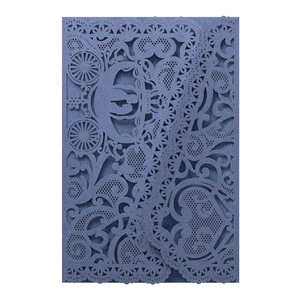 Detailed laser-cut floral and carriage pattern on navy blue pearlescent wedding invitation