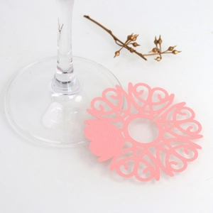 Pink heart laser-cut paper wine glass card with intricate floral hollow design details