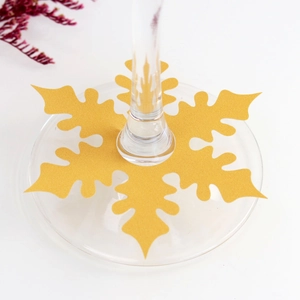 Sparkling gold snowflake wine glass charm for festive table setting and glass decoration