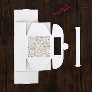 Detailed laser-cut hollow floral pattern on white wedding favor gift box template