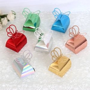 Detailed view of 3D butterfly candy boxes in assorted metallic laser finish colors