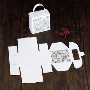 Laser-cut white wedding favor box showing flat template and assembled 3D structure