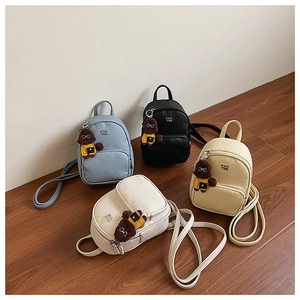 Mini sacs à dos en similicuir en quatre couleurs avec breloques de chien et texture